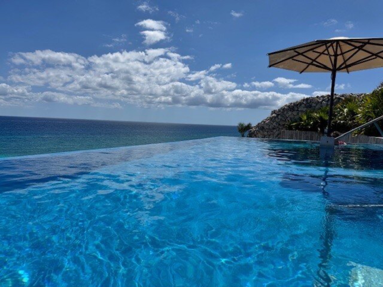 Rooftop infinity Sky Pool at La Casa de la Playa overlooking the turquoise Caribbean Sea